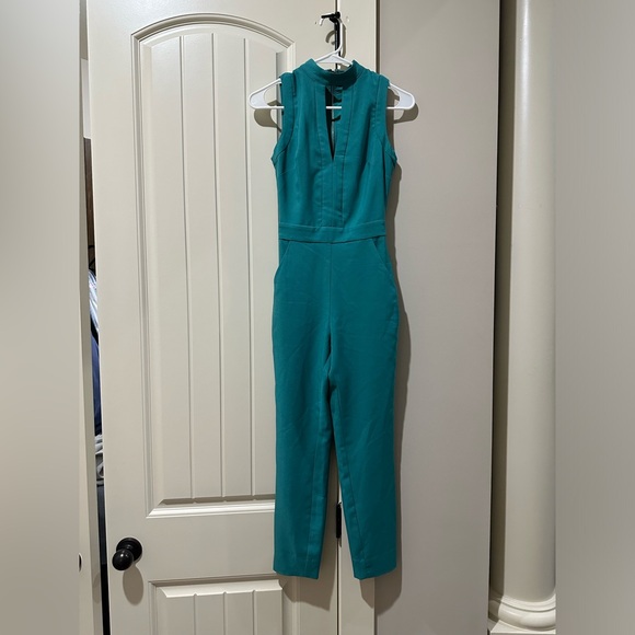 Bebe Sleeveless Jumpsuit Mock-neck Keyhole Aqua Lined Straight Leg Size 00 - Picture 1 of 2